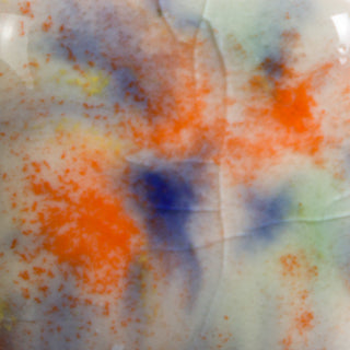 Cone 06: Opaque white base glaze with orange, yellow, and blue/green crystals; base and crystals fade with enhanced mobility at Cone 6. Amaranth Stoneware Canada.
