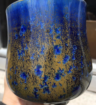 Piece by Heather Binder. Crystal Lagoon glaze, a dramatic blend of deep cobalt blue where thick and brown where thin, with large blue crystals forming when slow cooled. Amaranth Stoneware Canada.