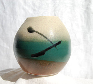Solid green Forest Satin glaze with a smooth, opaque finish. Ideal for use on its own or under runnier glazes.
