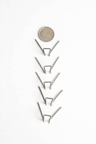 These heat-resistant wire Cone Holders ensure accurate firing by holding junior pyrometric cones in the correct position. Rated to Cone 13. 5 holders per pack. Amaranth Stoneware Canada.