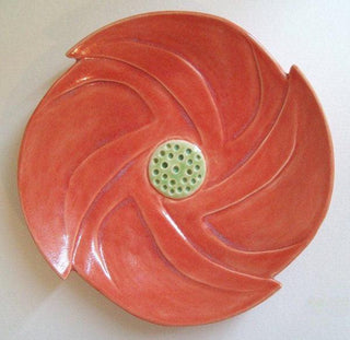 Sedona Sunset Glaze on white stoneware. A bright, translucent glaze that adds warmth without hiding detail. Easy to apply and reliable. Amaranth Stoneware Canada.