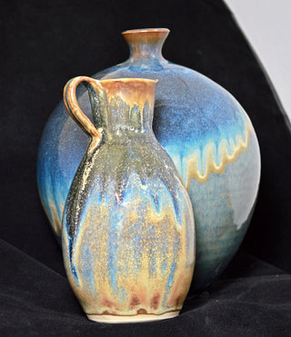 Orion is a signature glaze from the Constellation Series, transitioning from brown to bronze and blue, with golden crystals in slow cooling. Amaranth Stoneware Canada.