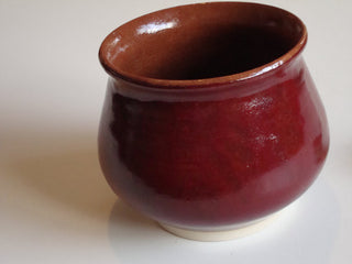 Deep Firebrick is an opaque, speckled brick red glaze that breaks translucent where thin. Amaranth Stoneware Canada.