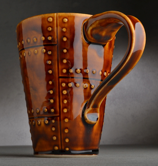 A translucent brown glaze that pools beautifully, varying from caramel to deep chestnut. Amaranth Stoneware Canada.