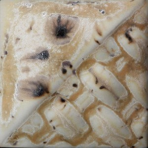 Sandstone matte off-white glaze with brown crystals at Cone 6; thicker application and heavy crystals create glossy blue/purple variation.
At Cone 10: Color darkens, glossy blue/purples become more prominent. Amaranth Stoneware Canada.