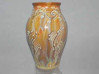 A variegated glaze with brown, orange, blue, and gold tones. Alternative to Red Gold. Amaranth Stoneware Canada.