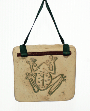 Handcrafted 4x4-inch stoneware Botanicals featuring seasonal plants and creatures. Finished with dogwood and ribbon. Weatherproof. Handcrafted in Kingston, Ontario at Amaranth Stoneware.