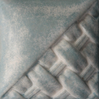 Cone 6: Storm Gray produces medium gray to white variegation; one coat gives matte gray, more coats build white variegation.
Cone 10: Off-white darkens, gray turns blue. Amaranth Stoneware Canada.