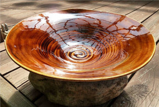 A translucent brown glaze that pools beautifully, varying from caramel to deep chestnut. Amaranth Stoneware Canada.