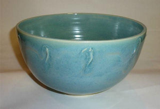 A brilliant pearlescent blue glaze that varies from translucent where thin to mottled where thick. It's possibly our runniest glaze. Amaranth Stoneware Canada.