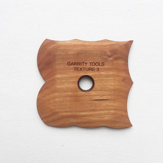 Texture 3 creates large curved ridges with unique patterns for consistent textures on your vessel or slab. 3.25" x 3.25", made of maple wood. Handmade in St. Louis, MO. Amaranth Stoneware Canada.