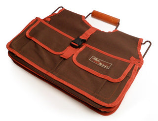 The Xiem Art Bag is a durable, breathable solution for ceramic tool storage. Features 17 pockets, 16 holsters, 2 large compartments, secure straps, and a reinforced bottom. Holds up to 25 lbs. Measures 16" x 9" x 12". Amaranth Stoneware Canada.